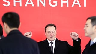 Vehicles are parked outside the Tesla plant, in Fremont, Calif., on May 12, 2020. A federal jury on Monday, April 3, 2023,