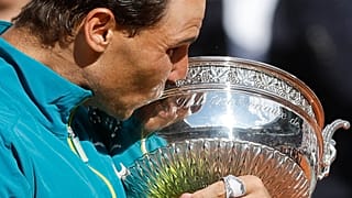 Spain's Rafael Nadal kisses the cup after defeating Norway's Casper Ruud in their final match of the French Open tennis tournament on 5 June 2022