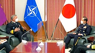 NATO Military Committee chief Rob Bauer, left, meets with Japanese Chief of Staff Koji Yamazaki