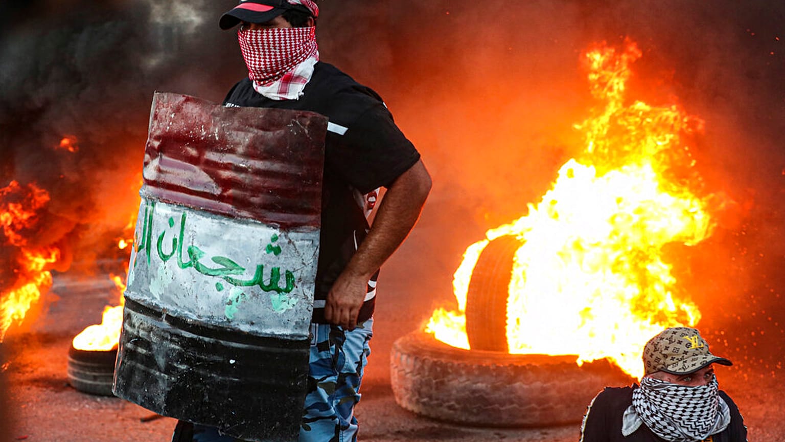 Protesters set tires on fire during an anti-government protest demanding free elections and against corruption (FILE)