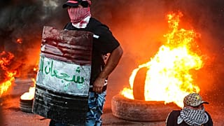 Protesters set tires on fire during an anti-government protest demanding free elections and against corruption (FILE)