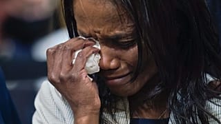 Serena Liebengood, widow of Capitol Police officer Howie Liebengood, cries as a video of the Jan. 6 attack on the U.S. Capitol is played during a public hearing