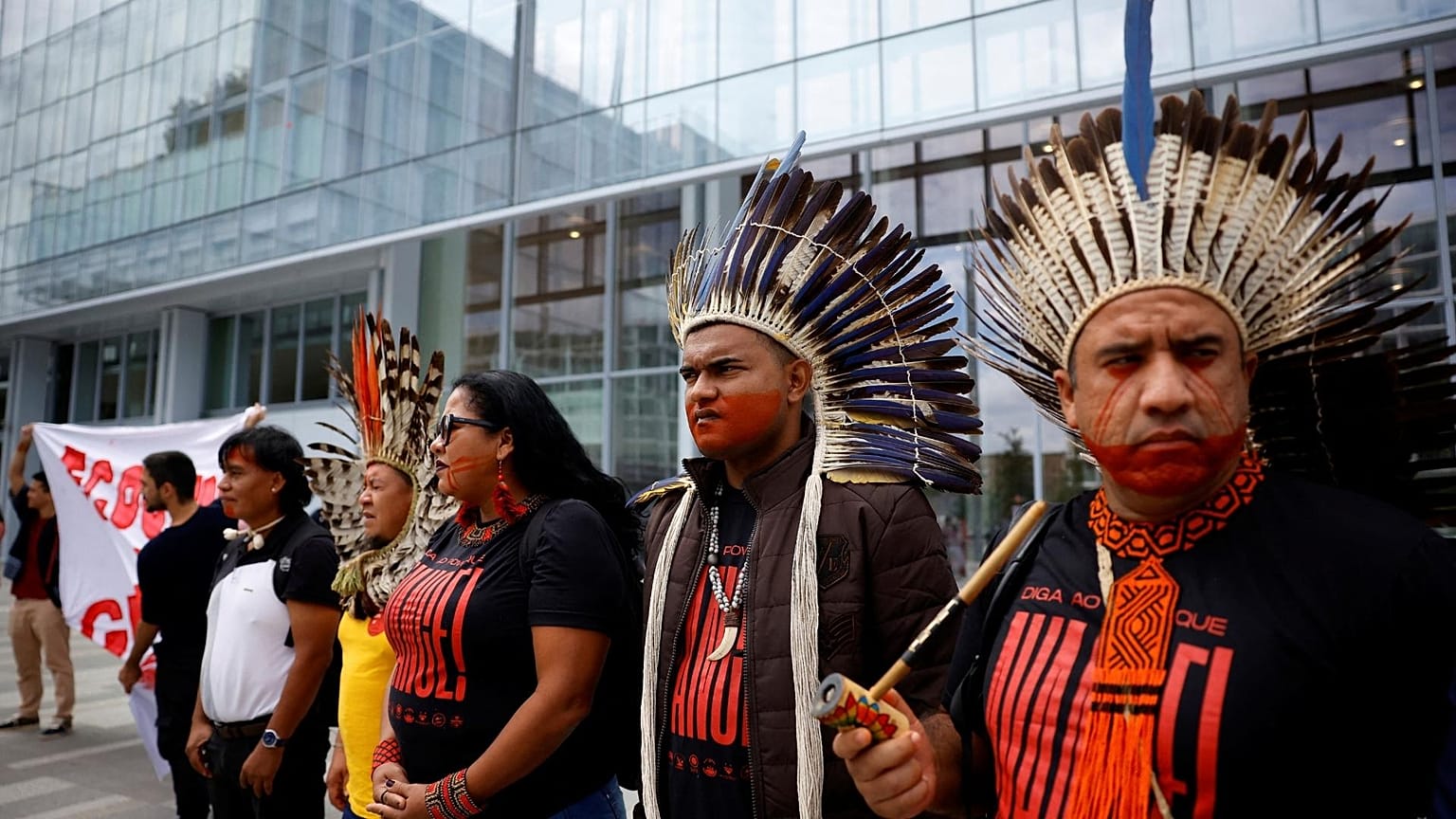 ndigenous groups from the Brazilian Amazon and Extinction Rebellion activists attend a protest in front of Paris courthouse.