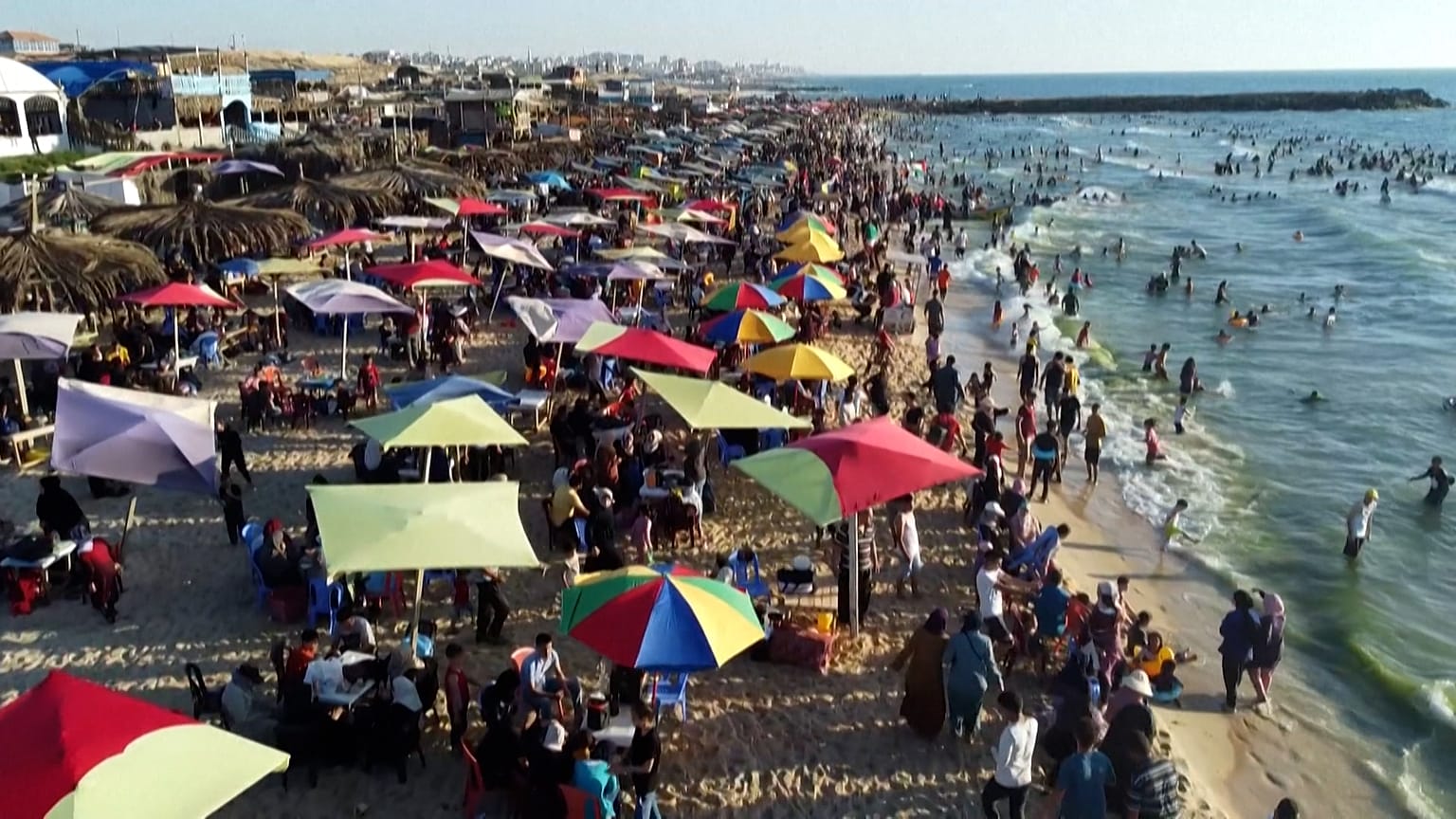 Palestinians swim in Mediterranean sea
