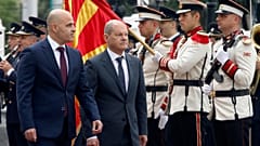 German Chancellor Olaf Scholz, with North Macedonia's Prime Minister Dimitar Kovachevski, reviewing an honour guard in Skopje, North Macedonia, on Saturday, June 11, 2022.