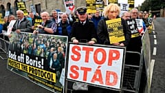 Demonstrators protest outside Hillsborough Castle, ahead of a visit by British Prime Minister Boris Johnson, in Hillsborough, Northern Ireland, May, 16, 2022.