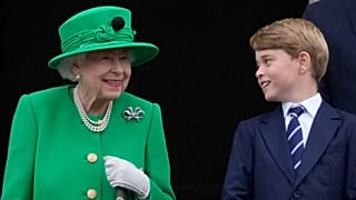 Britain's Queen Elizabeth II smiles at Prince George on the Buckingham Palace balcony during the Platinum Jubilee Pageant in London, Sunday, June 5, 2022