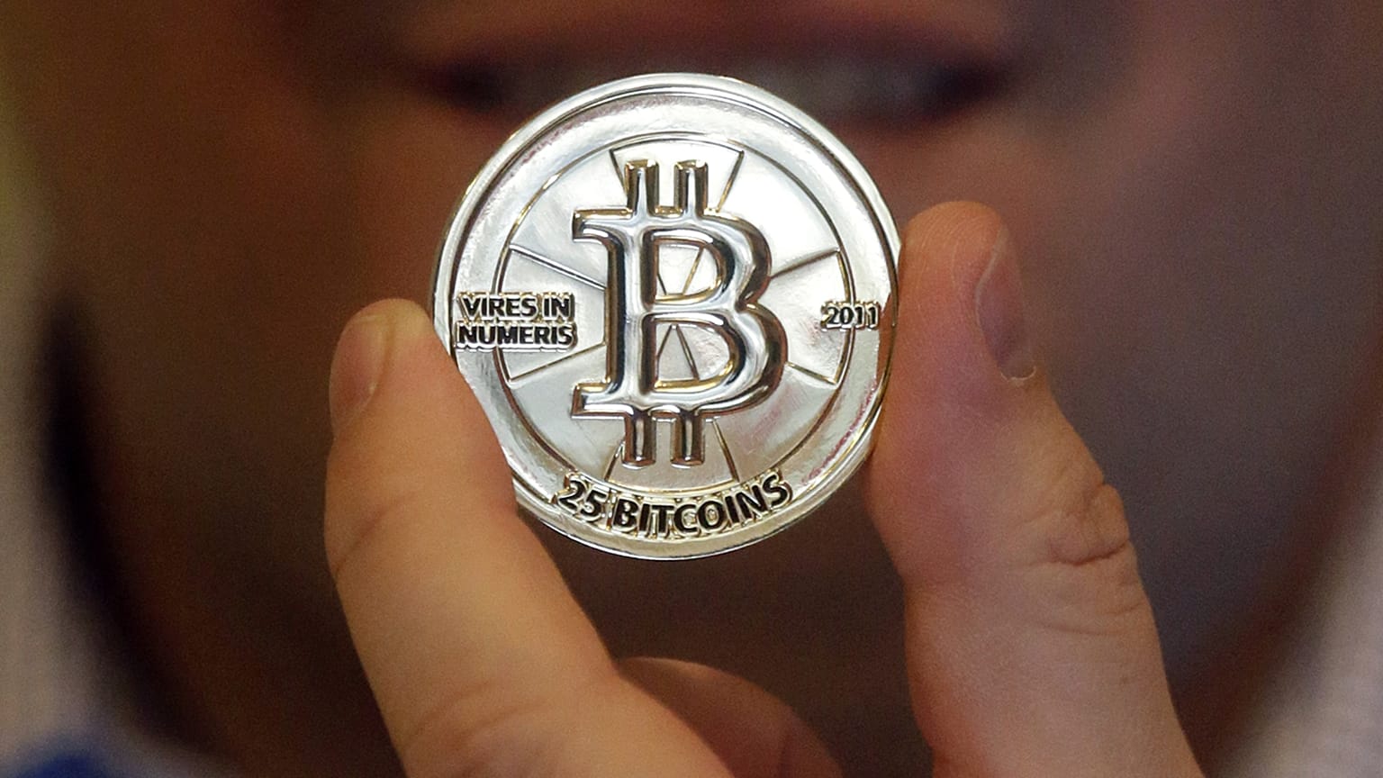 Imagen de un token con un valor de 25 bitcóins.