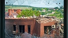 A heavily damaged house following Russian night shelling is seen through a broken window, in the town of Bakhmut, Donetsk region, Ukraine