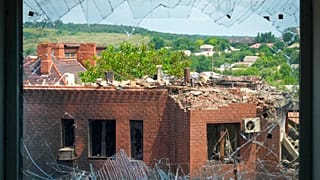 A heavily damaged house following Russian night shelling is seen through a broken window, in the town of Bakhmut, Donetsk region, Ukraine