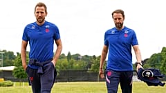 England's Harry Kane, left, walks with manager Gareth Southgate prior to a press conference ahead of Tuesday's UEFA Nations League soccer match