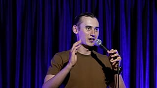 Serhiy Lipko performs in a stand-up comedy show in Kyiv, Ukraine