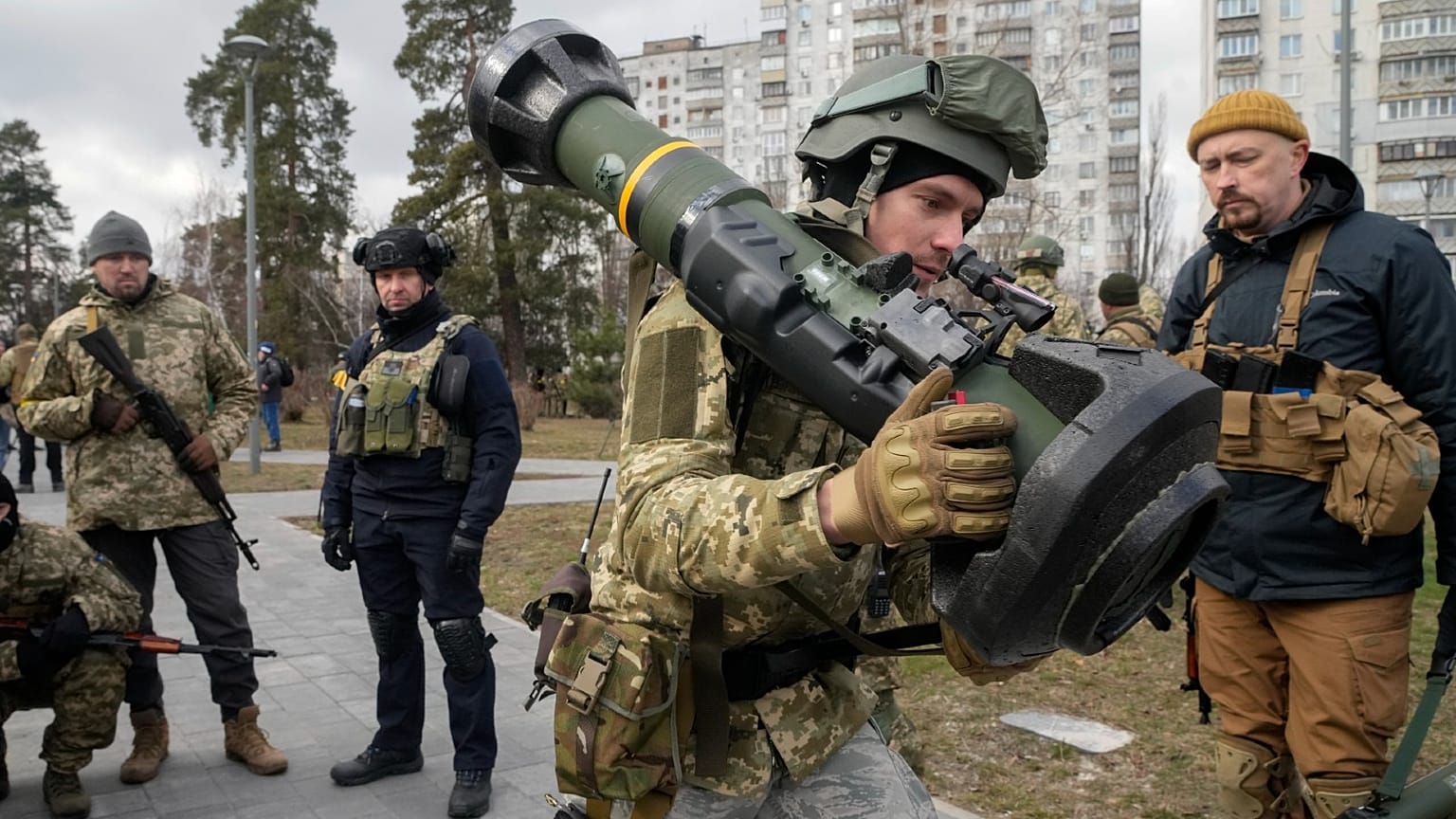 A Ukrainian Territorial Defence Forces member holds an NLAW anti-tank weapon, in the outskirts of Kyiv, Ukraine, Wednesday, March 9, 2022