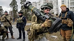 A Ukrainian Territorial Defence Forces member holds an NLAW anti-tank weapon, in the outskirts of Kyiv, Ukraine, Wednesday, March 9, 2022