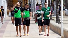 Tourists walk on the promenade at Magaluf Beach in Calvia, on the Balearic Island of Majorca.
