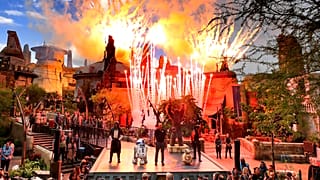 Fireworks blast during the dedication ceremony with invited guests at the entrance of the Star Wars: Galaxy's Edge attraction at Disney's Hollywood Studios, August, 2019.
