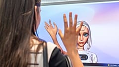 A visitor to VivaTech tries out some of the tech being showcased at the L'Oreal pavilion.