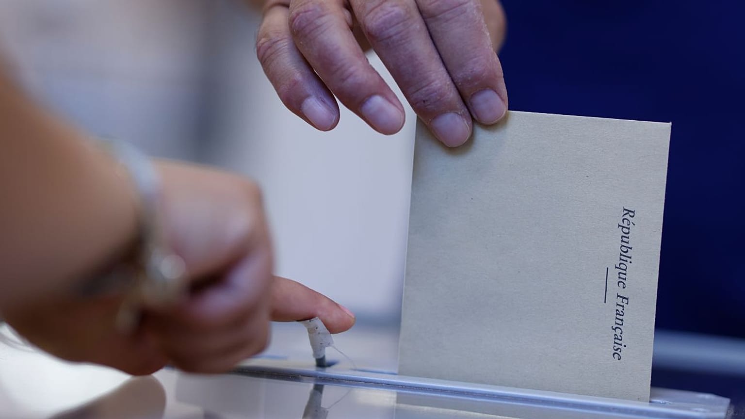 A man casts his ballot at a voting station in Strasbourg, eastern France, Sunday June 12, 2022.