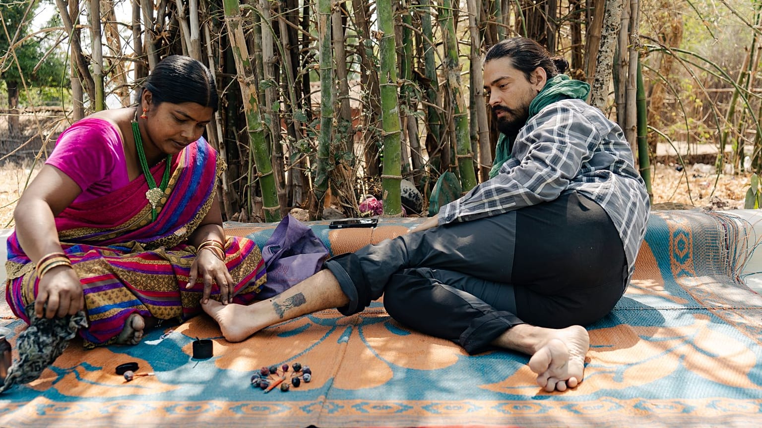 Amit Ajrel receiving a traditional tribal tattoo in Chhattisgarh, India
