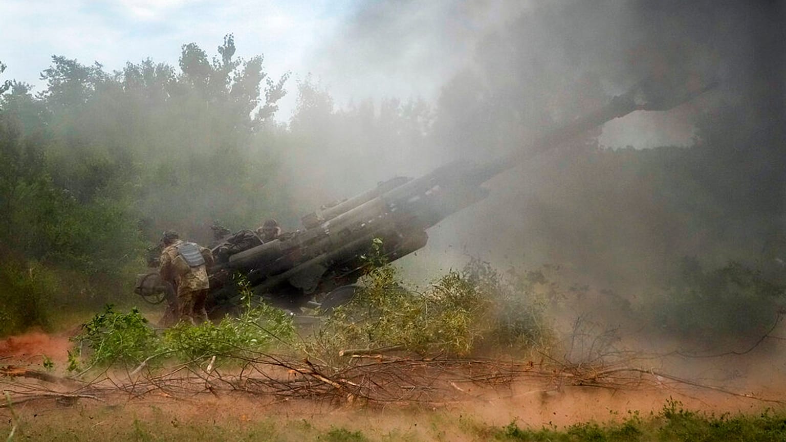 Ukrainian soldiers fire at Russian positions from a U.S.-supplied M777 howitzer in Ukraine's eastern Donetsk region, June 18, 2022
