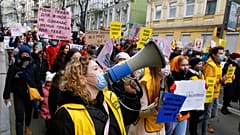 Women attend a rally on the occasion of the International Women's Day in Kyiv, Ukraine