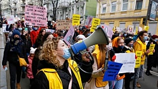 Women attend a rally on the occasion of the International Women's Day in Kyiv, Ukraine