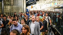 Passengers disembark from one of the few trains to arrive this morning at Waterloo railway station in London, Tuesday, June 21, 2022.