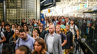 Passengers disembark from one of the few trains to arrive this morning at Waterloo railway station in London, Tuesday, June 21, 2022.
