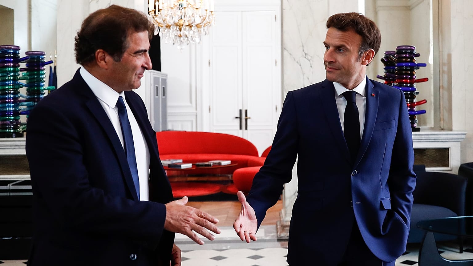 French President Emmanuel Macron, right, shakes hands with Christian Jacob, head of Les Republicains party after their meeting at the Elysee Palace in Paris, 21 June 2022.