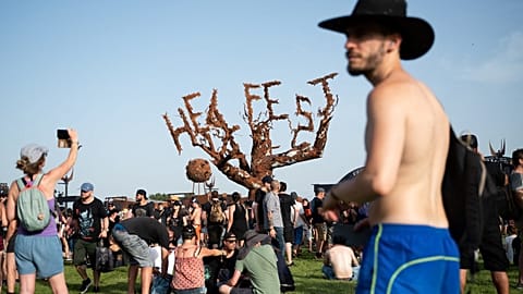 June 17, 2022 Festival goers attend the Hellfest Summer Open Air rock festival in Clisson, western France. 