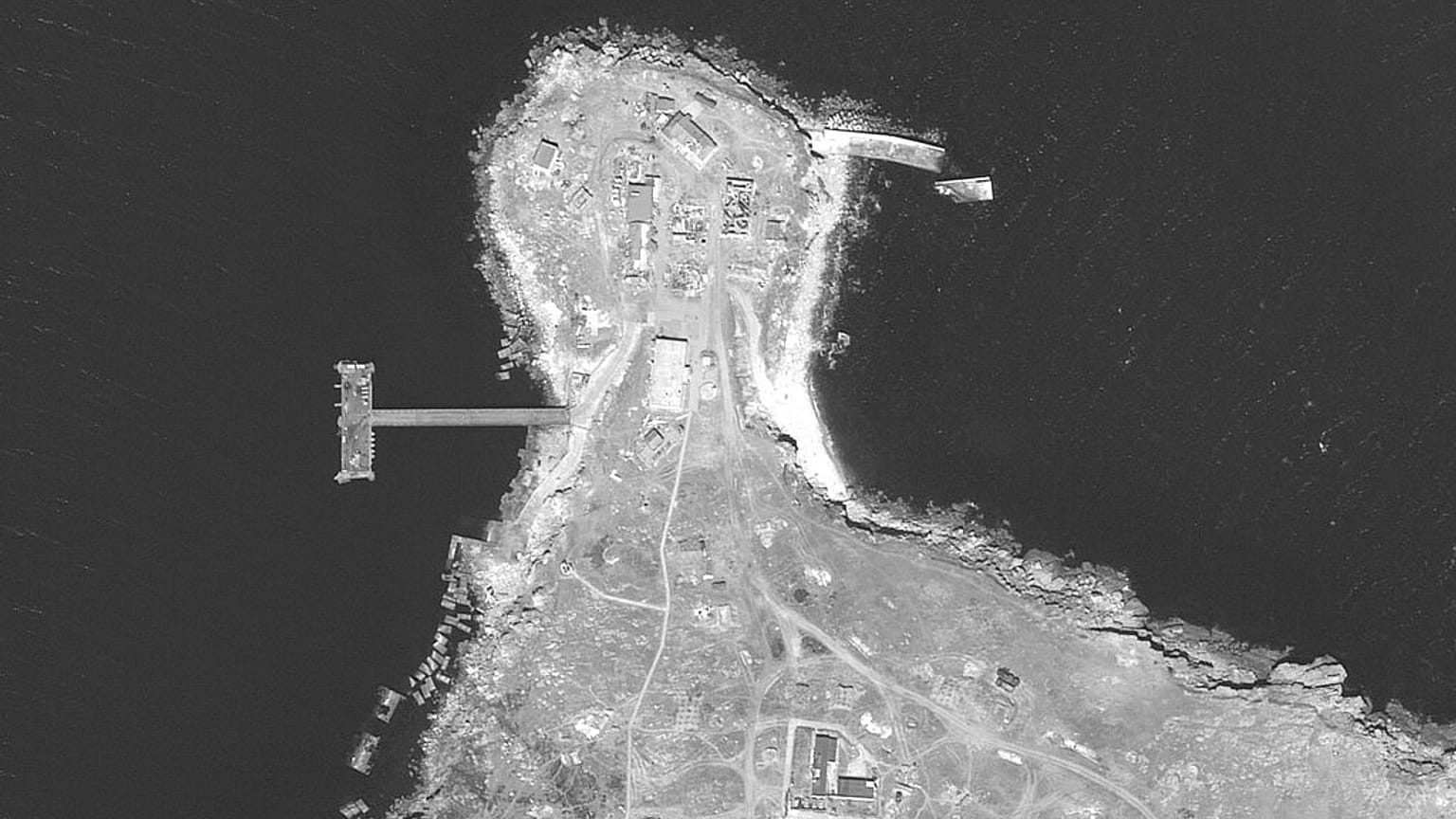 This WorldView-1 satellite black and white image from Maxar Technologies shows an overview of the northern end of Snake Island, in the Black Sea, on June 17, 2022. 