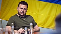 Ukrainian President Volodymyr Zelenskyy attends a meeting with military officials as he visits the war-hit Mykolaiv region. 