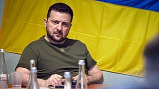 Ukrainian President Volodymyr Zelenskyy attends a meeting with military officials as he visits the war-hit Mykolaiv region. 