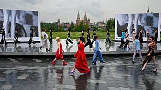 Models display a collection during the Fashion Week at Zaryadye Park near Red Square in Moscow