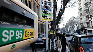 A car stops in a gas station where prices are up to 2,75 euros per liter (US dlrs. 3.04) in Marseille, southern France, Wednesday, March 9, 2022