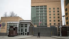 A security staff patrols the U.S. Embassy in Moscow.