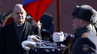 German Chancellor Olaf Scholz attends a wreath-laying ceremony at the Tomb of the Unknown Soldier at the Kremlin Wall in Moscow, Russia, Tuesday, Feb. 15, 2022