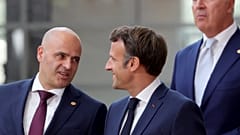 North Macedonia's Prime Minister Dimitar Kovacevski, left, speaks with French President Emmanuel Macron 