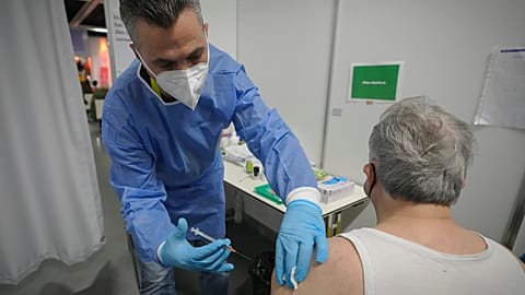 A man receives a COVID-19 vaccine on the second day of a national lockdown to combat soaring coronavirus infections in Vienna, November 2021
