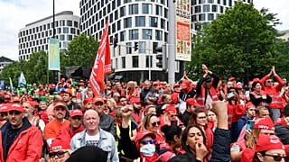 Members of various trade unions march during a demonstration in Brussels on June 20.