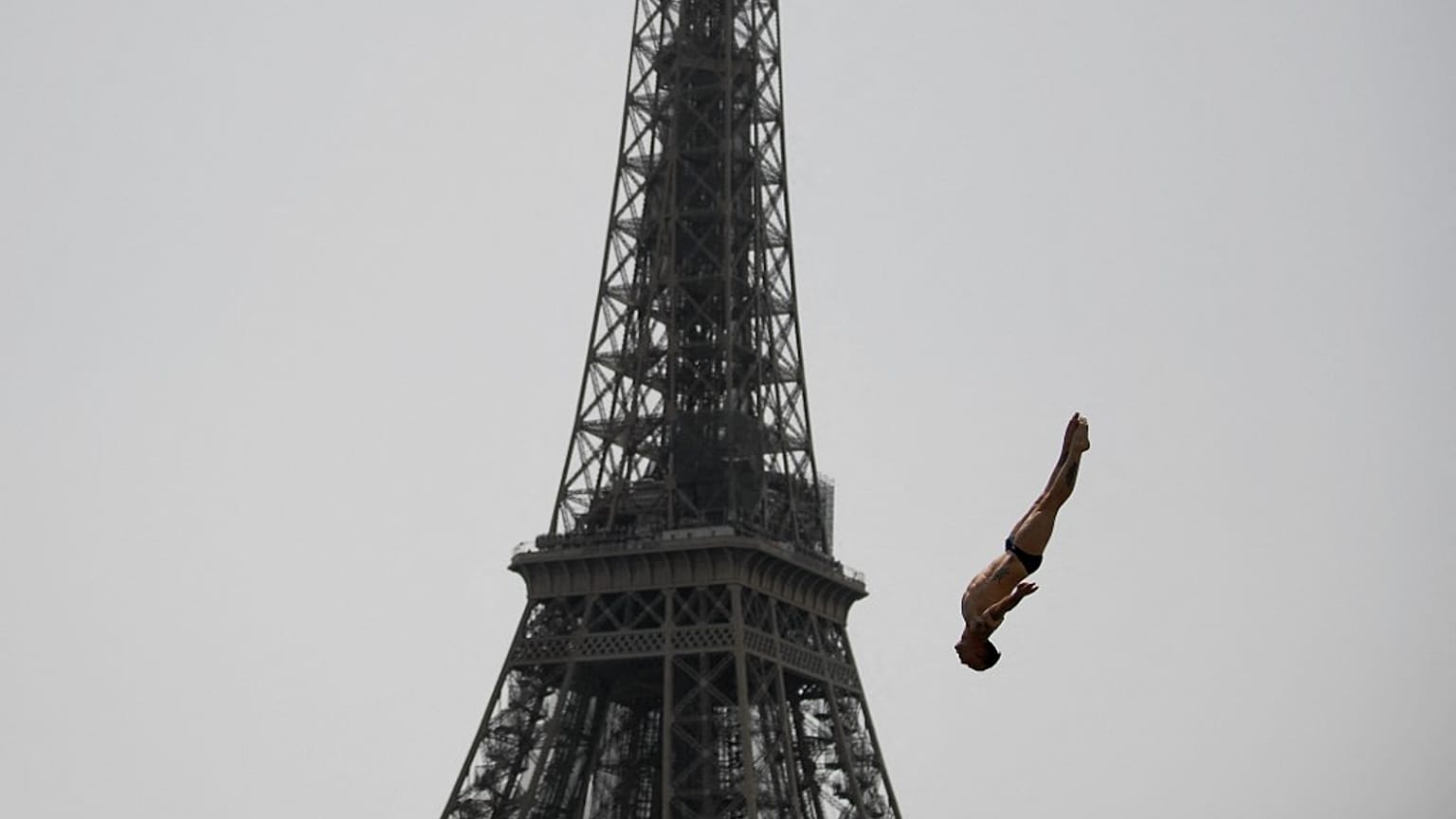 France's Gary Hunt takes a practice dive during the Red Bull Cliff Diving World Series near the Eiffel Tower in Paris, on June 18, 2022.