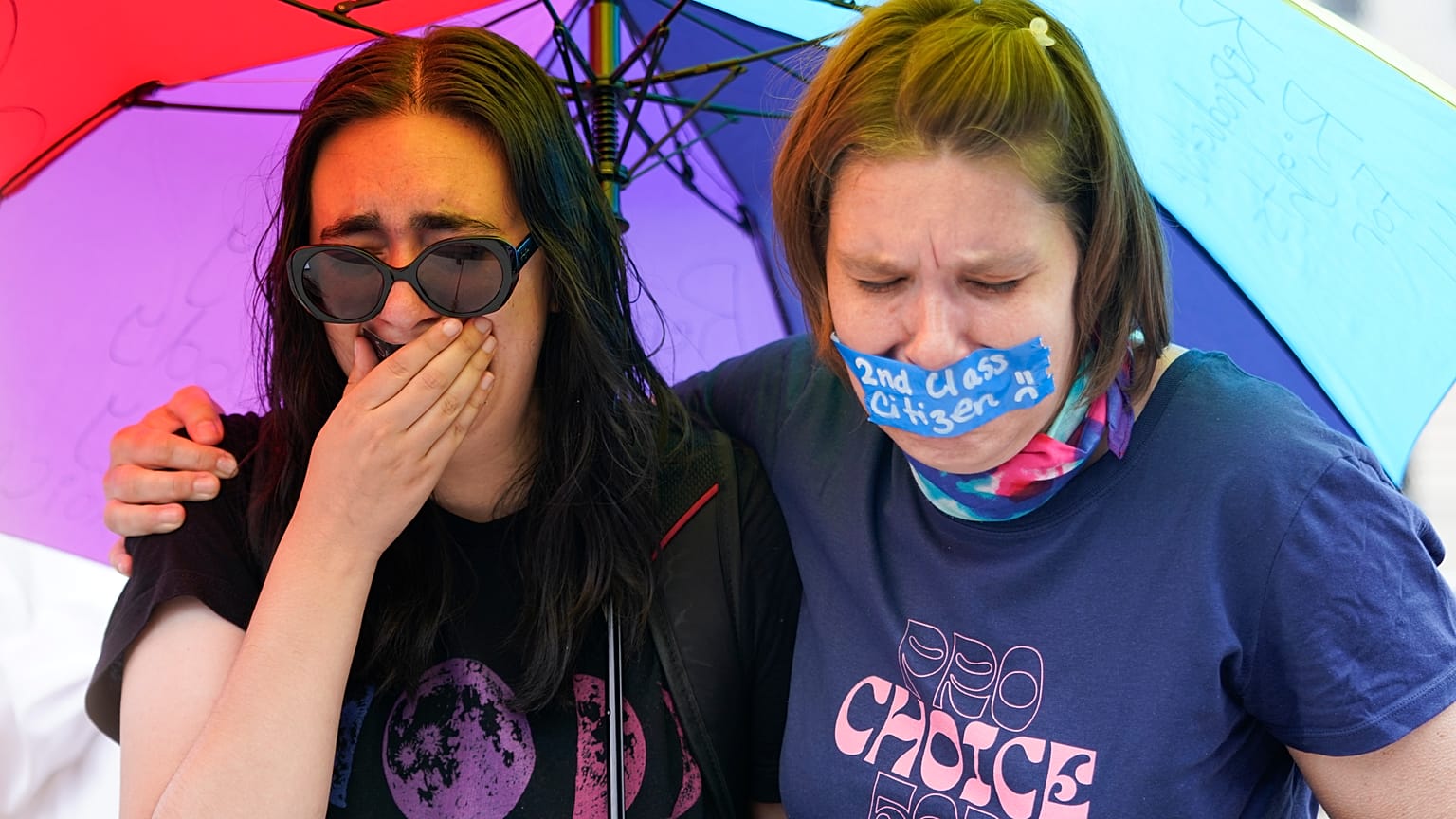 Abortion-rights activists in the US react after hearing the Supreme Court decision on abortion outside the Supreme Court in Washington, Friday, June 24, 2022.