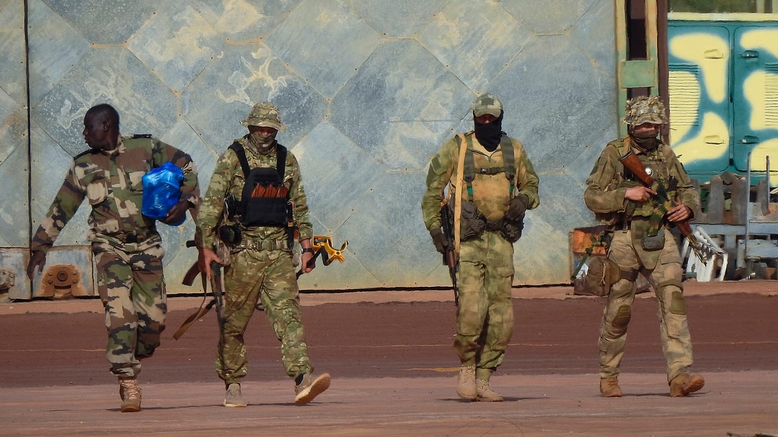 An undated file photograph issued by French military shows three Russian mercenaries, right, in northern Mali. 