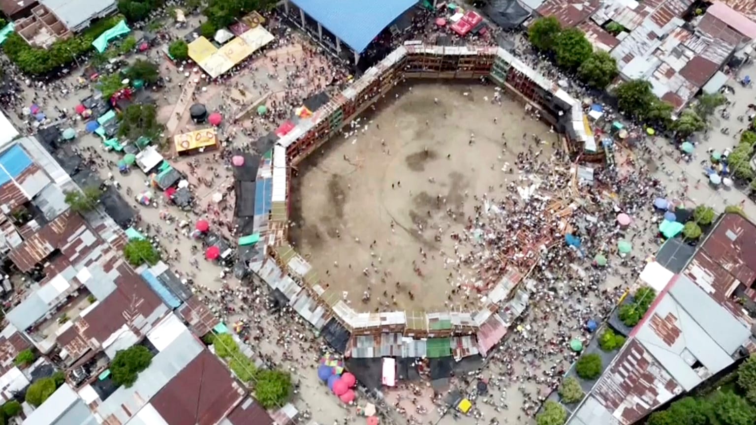 An image taken from video shows the scene after part of a wooden stand collapsed at a bullfight, Sunday, June 26, 2022, at El Espinal in Tolima state, central Colombia.