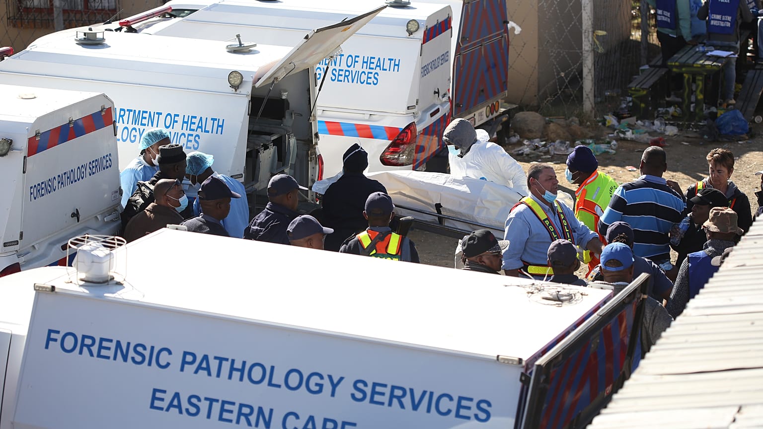 A body is removed from a nightclub in East London on June 26.