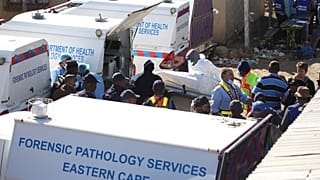 A body is removed from a nightclub in East London on June 26.