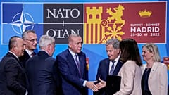 Turkish President Erdogan shakes hands with Swedish PM and Finnish President in Madrid, 28 June 2022