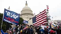 Violent insurrectionists loyal to President Donald Trump stand outside the U.S. Capitol in Washington on Jan. 6, 2021.