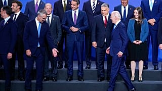 U.S. President Joe Biden, front right, arrives for a group photo during the NATO summit in Madrid