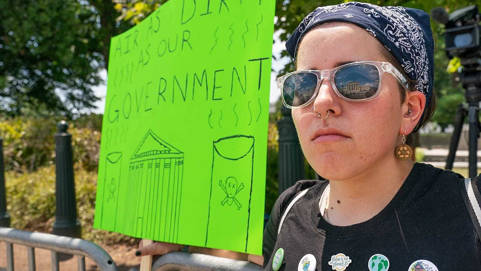 Erin Tinerella, of Chicago, who is in Washington for the summer at an internship, protests against climate change after the Supreme Court's EPA decision, June 30, 2022.
